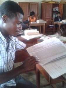 1 - Raymond Sappor looking through the register