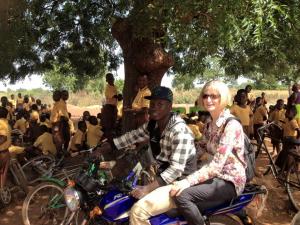 Loving the motorbike riding! Here is me with Elias, one of our local volunteers.