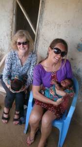 Holding Ziem and Naab, the beautiful twin daughters of our Kuoli small-business